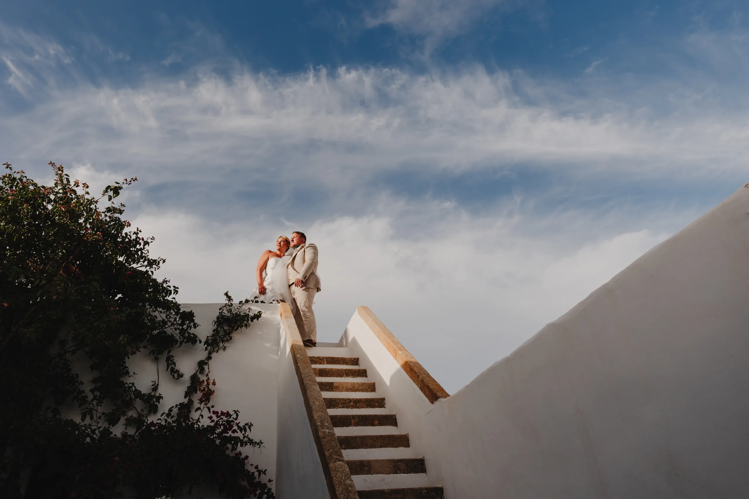 Newly married couple enjoying the Rhodes sunset on a balcony